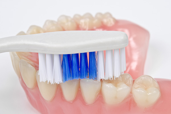 Preventing Bacteria Buildup On Dentures